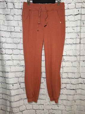 Marika. Orange joggers. Size S